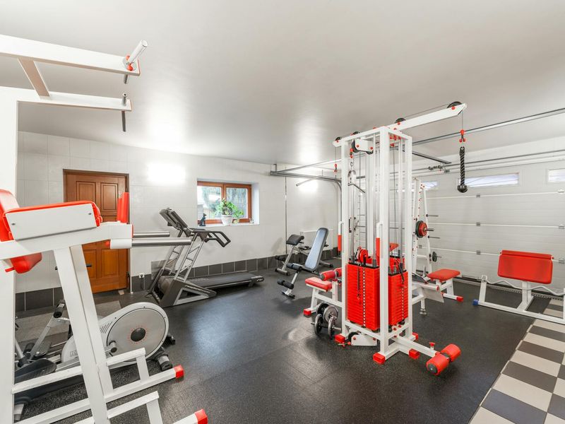 Bright and clean modern gym space with minimalist equipment