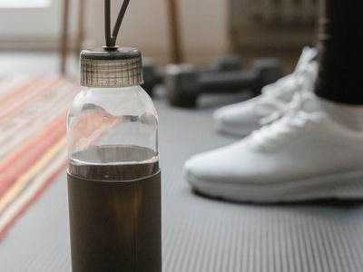 Macro shot of water bottle and training mat
